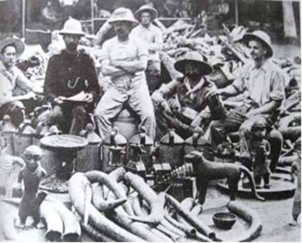 British soldiers of the infamous Punitive Expedition of 1897 proudly posing with the looted Benin artefacts.